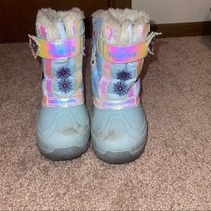 Frozen boots and black winter boots